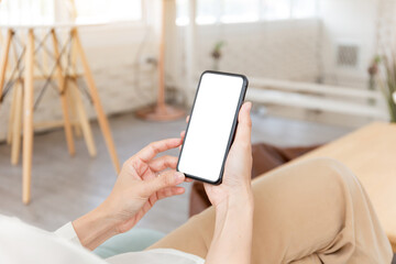 cell phone blank white screen mockup.hand holding texting using mobile on desk at office.background empty space for advertise.work people contact marketing business,technology