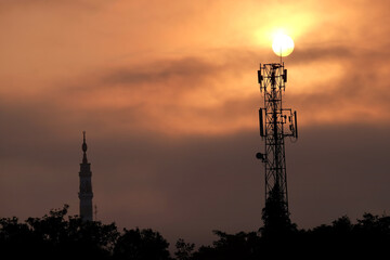 communication tower during sunrise. radio frequency transmission tower
