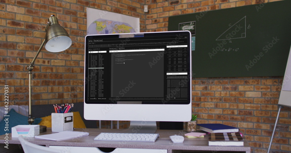 Poster computer screen with data processing standing on desk in office