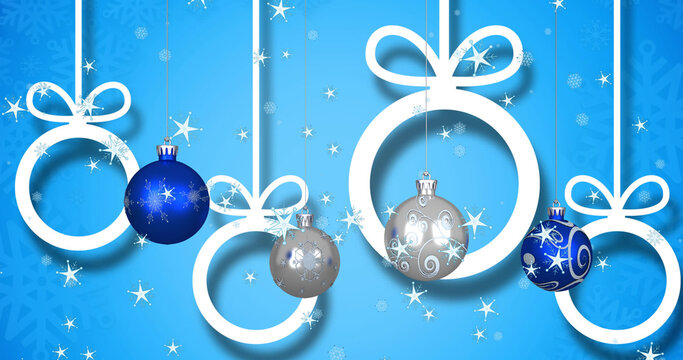 Image of christmas balls over stars on blue background