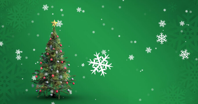 Image of falling snowflakes over christmas tree