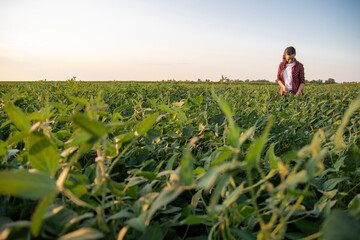 A female farmer in soybean field © ShoneNS