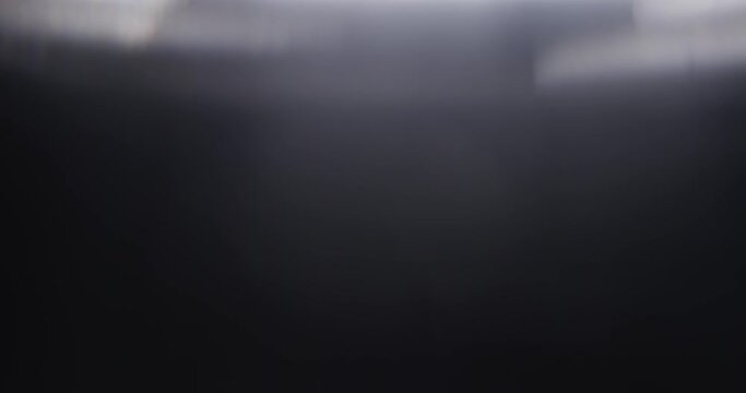Footage of White Lights Leaks Overlay on Black Background. Concept the Motion of Bokeh. Natural Lighting Lamp Rays Bokeh Effect. Background Compositing. 4K Resolution. Prism Lights.