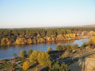 beautiful aerial autumn landscape with a view of the forest and the river at at sunny weather