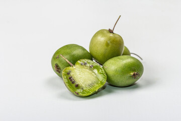 Ripe Actinidia arguta or kiwi isolated on white background