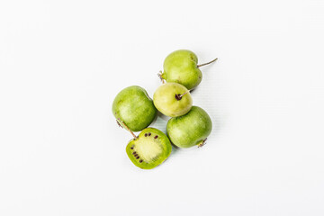 Ripe Actinidia arguta or kiwi isolated on white background