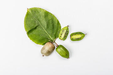 Ripe Actinidia arguta or kiwi isolated on white background