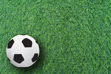 football ball on green grass field background.