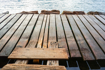 plank of wooden bridge floating water