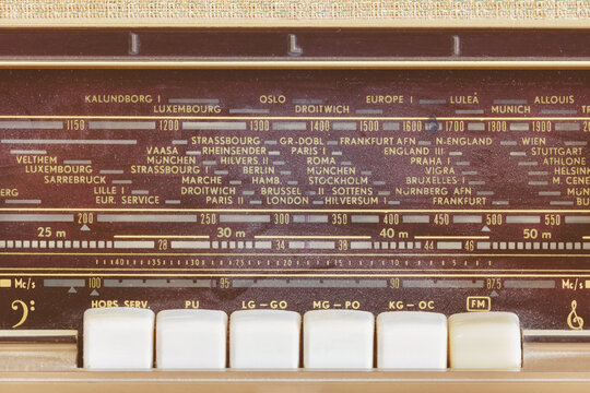 Close up view of a vintage radio with display showing European cities