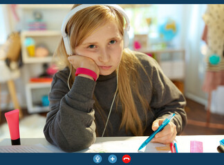 bored pupil learning online, having call at home in sunny day
