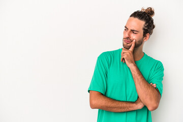 Young caucasian man isolated on white background looking sideways with doubtful and skeptical expression.