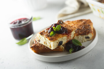 Traditional homemade cottage cheese pie with cherry sauce