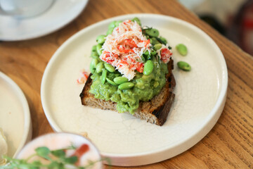 Healthy avocado toast with crab meat