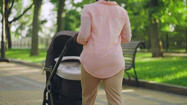 Sleepy Black Woman Yawning, Pushing Stroller In Park, Feeling Tired, Parenting