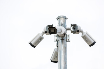 Online Security CCTV camera surveillance system outdoor of house. A blurred night city scape background. Real time Modern CCTV camera on a pole. Equipment system service for safety life or asset.