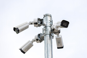 Online Security CCTV camera surveillance system outdoor of house. A blurred night city scape background. Real time Modern CCTV camera on a pole. Equipment system service for safety life or asset.