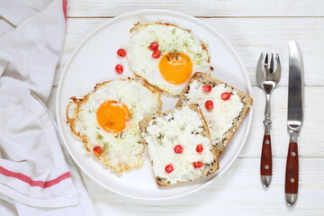 Scrambled eggs with ricotta sandwiches on white plate