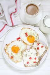 Scrambled eggs with coffee on white background