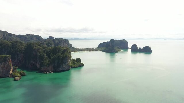 Aerial view of limestone mountains in Railey and Ao Nang beach at krabi province, Thailand, one of the most popular island in Andaman sea. Tourism, Travel destination and summer vacation concept.