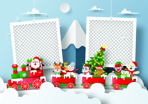 Santa Claus and friend on Xmas train at the snow mountain with blank photo frame