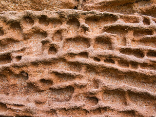 Natural patterns in sandstone eroded by the action of the weather.