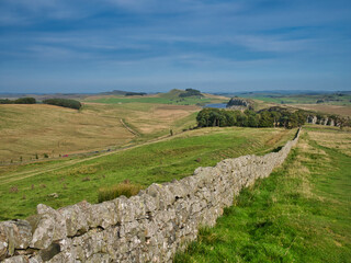 In open countryside, the route of Hadrian's Wall in Northumberland, England, UK. Begun in AD122, the wall ran across Britain forming the northern boundary of the Roman Empire.