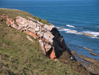 Exposed rock strata on the Northumberland Coast near Scremerston, south of Berwick-upon-Tweed -...