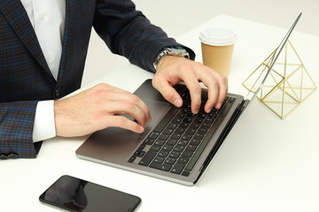 Business concept with young man working on laptop