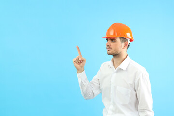 Businessman builder with idea on blue background, space for text