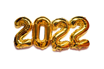 Gold foil balloons isolated on white background. Golden decoration holiday Happy new year 2022.
