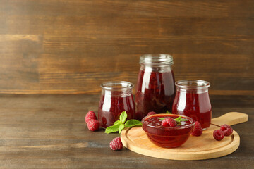 Fototapeta na wymiar Concept of tasty food with raspberry jam on wooden background