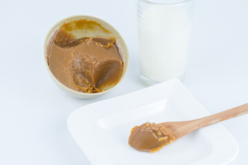 Traditional Christmas dulce de leche from the Valle del Cauca region of Colombia called Dulce de Manjar Blanco packaged in a container of plant origin fruit of the totumo tree