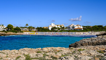 beach of cala'n bosch, Menorca, Balearic Islands, Spain. blue sea and houses.
