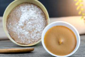 Traditional Christmas dulce de leche from the Valle del Cauca region of Colombia called Dulce de Manjar Blanco packaged in a container of plant origin fruit of the totumo tree