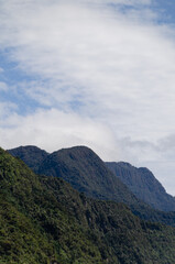 Portrait shot of mountains against the sky