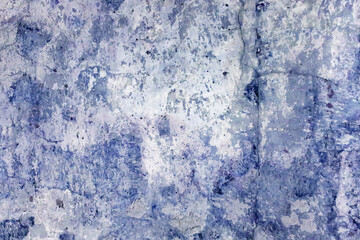 the texture of an old wall with cracks, scratches that can be used as a background. Vintage graffiti background in blue tones. Image of cracks in the paint.