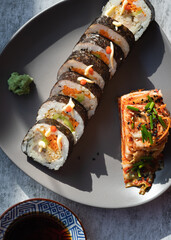 Korean traditional food Kimbap rolls slices, served with Kimchi