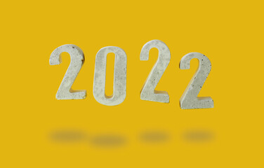 concept of levitation digits 2022 on yellow background..