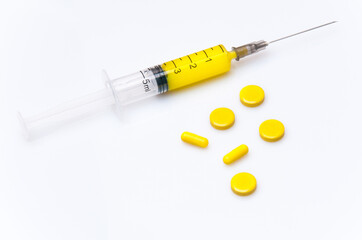 medical syringe with yellow liquid