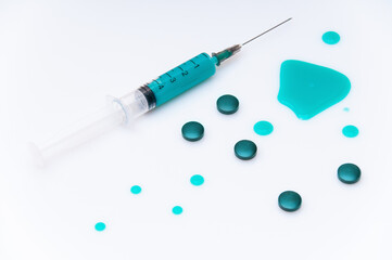 medical syringe with blue liquid