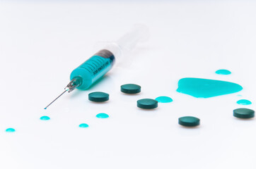 medical syringe with blue liquid