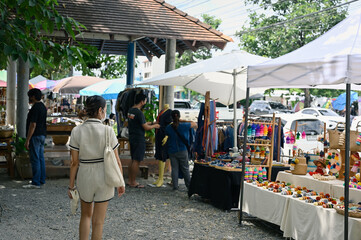 Young women walking in street market souvenir zone , Chiang mai , Thailand