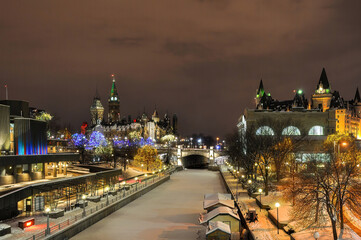 Foggy winter night with Christmas light on Rideau Canal in Ottawa, Canada