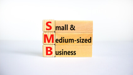 SMB small and medium-sized business symbol. Words SMB small and medium-sized business on blocks on a beautiful white background. Business and SMB small and medium-sized business concept. Copy space.