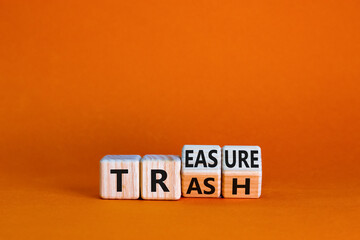 Trash to treasure symbol. Businessman turned cubes and changed the word trash to treasure....