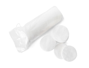 Many round cotton pads on white background