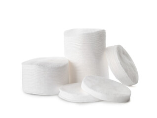 Many round cotton pads on white background