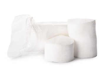 Many round cotton pads on white background