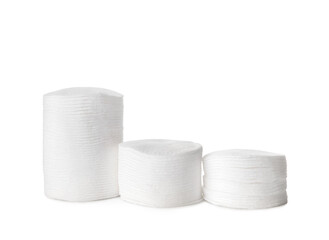 Stacks of clean cotton pads on white background